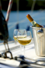 Pair of wineglasses against the yacht