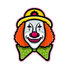 Mascot icon illustration of head of a vintage whiteface circus clown viewed from front  on isolated background in retro style.