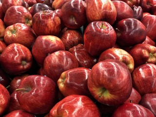 Red juicy apples on a crate 