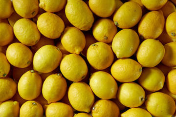 Full Frame Shot Of Fresh Lemons At Market Stall.