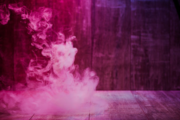 smoke isolated on colorful wooden background