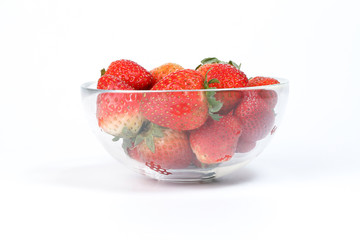 Red Ripe Strawberry in glass bowl on white background