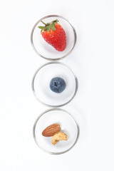 Blueberry Strawberry Herb Spice Almond Cashew Nut in glass bowl on white background