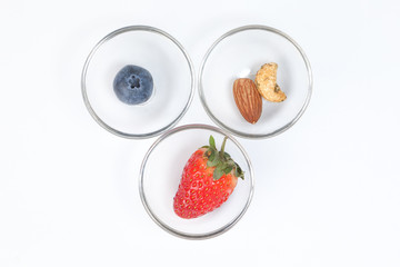 Blueberry Strawberry Herb Spice Almond Cashew Nut in glass bowl on white background