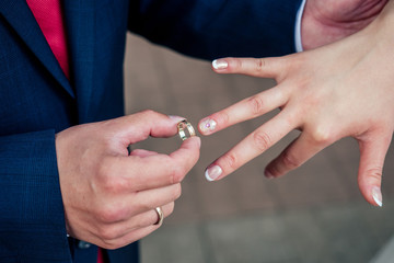 Obraz na płótnie Canvas Groom wear a bride ring. Wedding offer, engagement, family education - concept