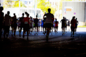 Colorful Silhouette of marathon runners in the city 