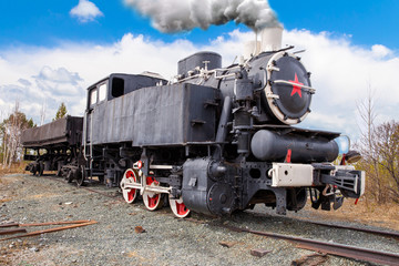 Old Soviet steam locomotive with a red star