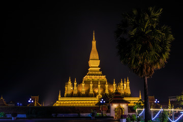 Pha That Luang a gold buddhist stupa in the night, landmark of Vientiane, Laos PDR.
