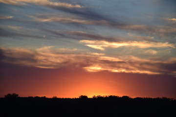 A colorful dusk over an outdoor skyline
