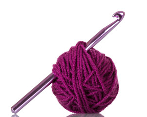 Ball of fluffy yarn and hook for needlework isolated on white
