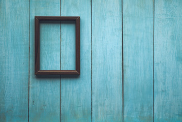 Obraz na płótnie Canvas wooden photo frame on wooden wall