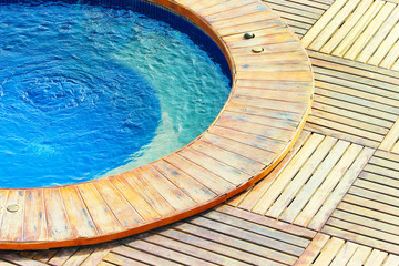 Outdoor jacuzzi pool with fresh blue water. - obrazy, fototapety, plakaty