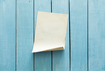 old paper on blue wall