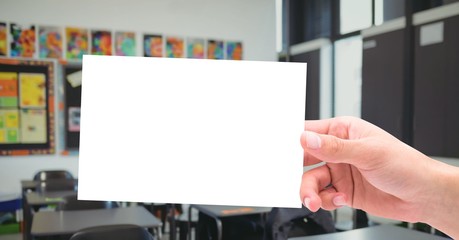 hand holding education card in classroom