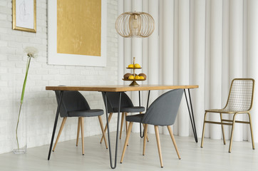 Gray chairs at wooden table