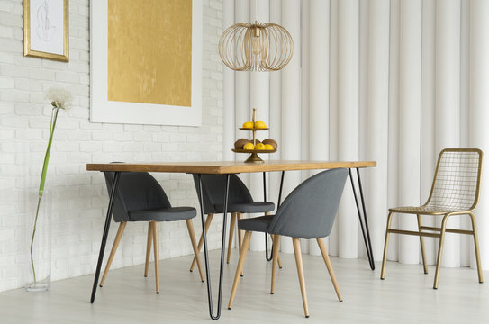 Gray chairs at wooden table