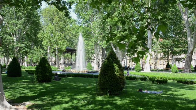 Park Zrinjevac in downtown Zagreb in spring. Fountain in green park. Zagreb is the capital and the largest city of Croatia.