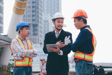 Engineering grop working together at outdoor,happy Teamwork concept.