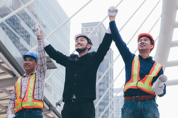 Engineering grop working together at outdoor,happy Teamwork concept.