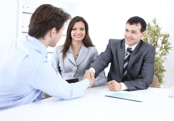 Fototapeta premium handshake business partners in the workplace