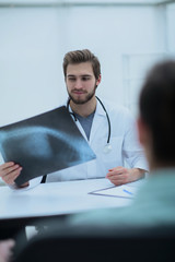 doctor examining x-ray picture of the patient