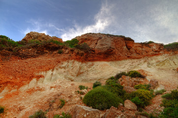 Soil profile in a cliff, showing terra rossa, reddish soil, heavy and clay-rich, developed on a limestone base