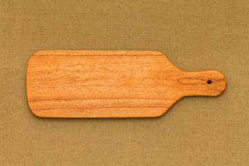 Long strips of handmade chopping board on black cotton cloth