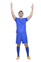 Happy asian football player posing celebrate