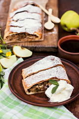 Strudel with apples. Summer breakfast in nature.