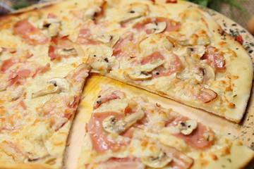 Pizza thin with sausage, mushrooms, cheese, spices