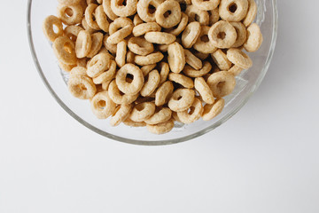 Pile of crispy cracknels in bowl , food background