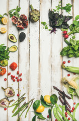 Fototapeta na wymiar Healthy raw summer vegan ingredients. Flat-lay of colorful vegetables and greens on white table background, top view, copy space. Clean eating, dieting party food