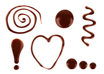 A set of chocolate drops of various shapes with a white background