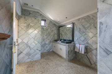 Modern bathroom in grey tone. Contemporary bathroom with gray tiles.