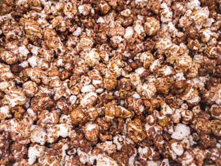 Scattered salted popcorn, texture background.