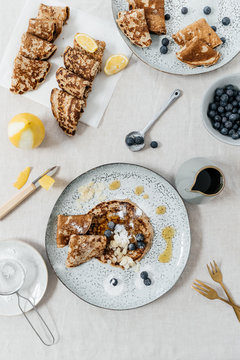 Homemade pancakes with sugar, blueberry, lemon, almond and honey.