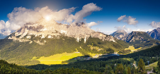 Fototapeta premium Sunny view of the wonderful alpine valley. Location place Misurina, Dolomiti alp, Tyrol, Italy.