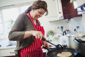 Mature Woman Making Chapati at Home