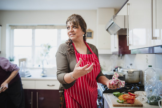 Mature Woman Preparing Food for Dinner Party