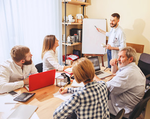 Obraz premium Team job. Photo young businessmans working with new project in office