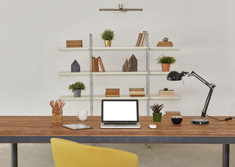 workplace and office interior with laptop and tablet devices. Black lamp bookcase book and pencil with wood table details.