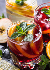 Sangria with fruit, ice and mint in glass. 