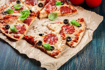 Slices of pizza pepperoni with olives