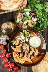 Chicken Souvlaki with french fries and tzatziki sauce