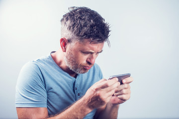 Handsome young man using mobile phone