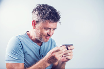 Handsome young man using mobile phone