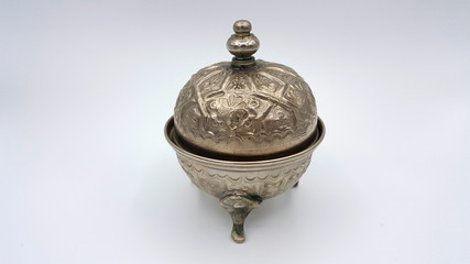 Antique silver pitcher isolated on a white background