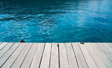 Plakat empty wood desk and summer blue sea background .Blank space for text and images.