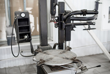 Car service center with modern workbench and tire fitting equipment