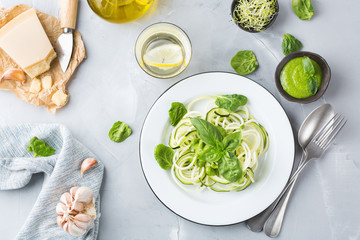 Seasonal zucchini spaghetti pasta noodles with spinach pesto sauce
